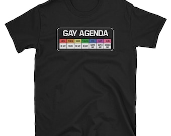May include: Black t-shirt with a white graphic of a calendar that says "Gay Agenda" with the days of the week and activities for each day.
