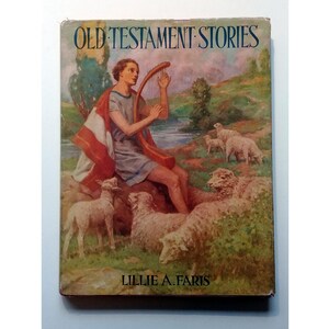 May include: A vintage book cover with the title "Old Testament Stories" in bold, black letters. The cover features a painting of a man playing a harp while sitting on a rock with sheep in the background. The author's name, "Lillie A. Faris", is printed in black at the bottom of the cover.