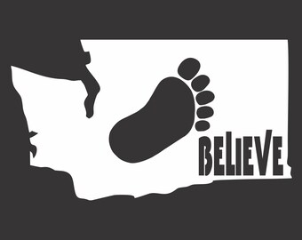 May include: A white silhouette of the state of Washington with a large footprint inside and the word "BELIEVE" printed below the footprint.
