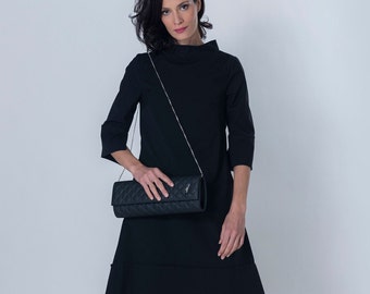 Black Padded Leather Clutch Bag Minimalist Detail Cocktail Outfit