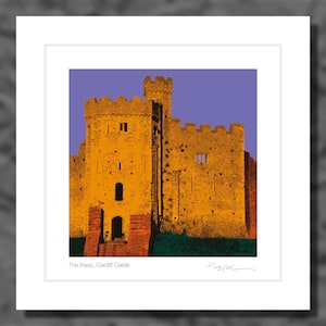 May include: A print of The Keep, Cardiff Castle, showcasing a detailed illustration of the castle's stone structure. The artwork uses a palette of gold, orange, and purple, with the castle set against a purple sky. The text "The Keep, Cardiff Castle" is at the bottom.