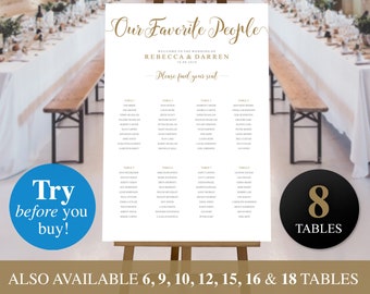 May include: White wedding seating chart with gold calligraphy text that reads "Our Favorite People" and "Welcome to the Wedding of Rebecca & Darren". The chart lists 8 tables with guest names. The chart is displayed on a wooden easel. A black and gold circle with the text "8 Tables" is in the lower right corner of the image.