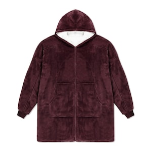 May include: A deep burgundy zip-up hoodie made of plush fleece material. This garment features a hood lined with white sherpa fabric, long sleeves with ribbed cuffs, and two large front pockets. The design includes a full-length front zipper.