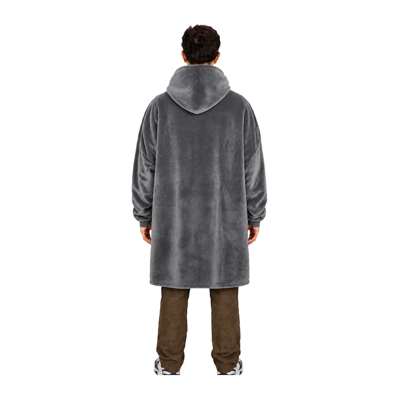 May include: An oversized, charcoal gray hooded sweatshirt made of a soft, plush fleece material. The garment features long sleeves with ribbed cuffs, a large integrated hood, and a loose, relaxed fit that extends to the mid-thigh area.