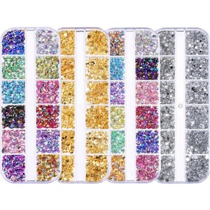 May include: Six clear plastic containers filled with various colors of rhinestones and glitter. Each container has 12 compartments filled with different shapes and sizes of embellishments.