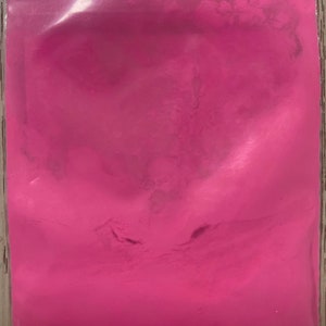 May include: A resealable bag filled with bright pink powder.
