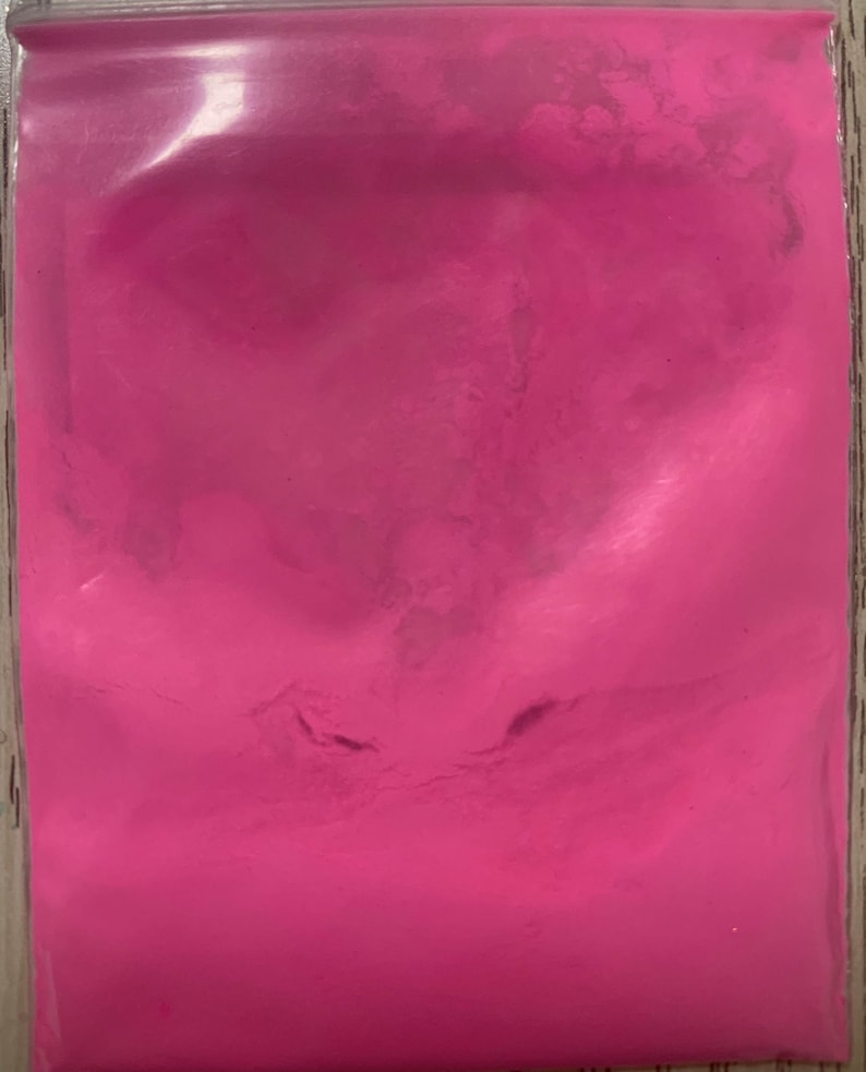 May include: A resealable bag filled with bright pink powder.