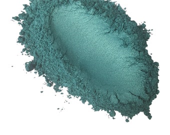 May include: A pile of teal green mica powder, a type of pigment used in crafts and cosmetics.