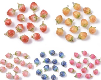 May include: Assortment of colorful glass fruit charms with gold accents. The charms are shaped like strawberries and peaches. The charms are perfect for jewelry making, scrapbooking, and other craft projects.