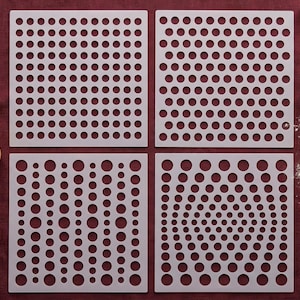 May include: Four square, off-white stencils with various dot patterns. The stencils are arranged on a burgundy surface, with a rolling pin, cookie cutters, and a tool with the text "DIY" visible. These stencils are ideal for baking and crafting.