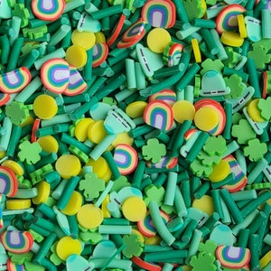 May include: A selection of green, white and yellow sprinkles in the shape of shamrocks, rainbows and other designs. The sprinkles are ideal for decorating cakes, cupcakes and other desserts.