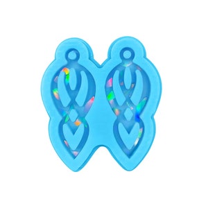 May include: A light blue silicone mold for making earrings. The mold has two cavities, each shaped like a dangling earring with a geometric design.