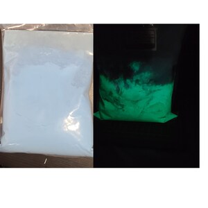 May include: A white powder in a clear plastic bag glows green under a black light. The powder is a glow-in-the-dark pigment.