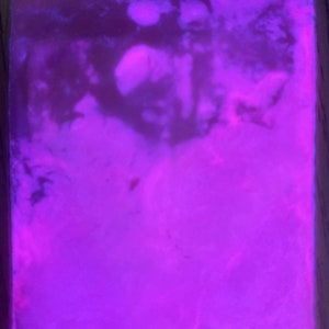 May include: A close-up of a purple, swirling, textured, abstract background.