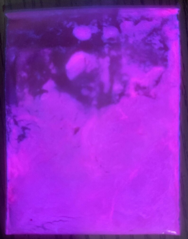 May include: A close-up of a purple, swirling, textured, abstract background.