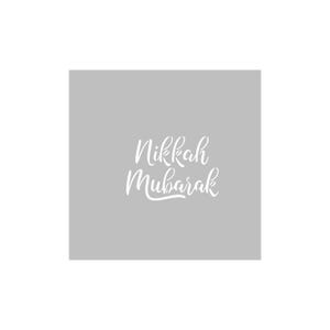 May include: A light grey background with the white script text "Nikkah Mubarak". The text is in a flowing, elegant font. The image is a simple, clean design.