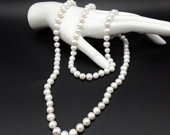 The Pearl Moon Necklace and Silver Pearl Earrings made of high quality pure white Pearls, 925 pure Silver and top of the line Silk Threat