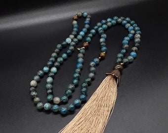 The Apatite 108 Mantra Mala Tassel Necklace made of high quality Natural Natural Apatite, pure Tiger's Eye, pure Bronze and pure Hematite.