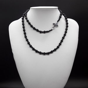 The Black Onyx Rosary Necklace made of Triple-A high quality pure Black Onyx and a stainless unbreakable steel Silver Cross.