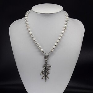 The Elegant Pearl Olive branch Necklace made of AAA+ Freshwater Pearls, Zircon, Pure 925 Silver; an Olive branch pendant of pure 925 Silver.