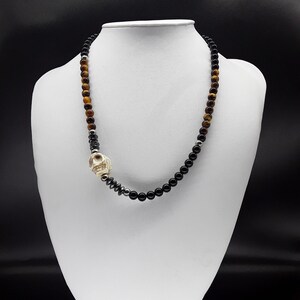 The Dark Skull Necklace made of AAA Pure high quality Black Onyx, Howlite (Skull), Hematite and Tiger&#39;s Eye and unbreakable pure steel.