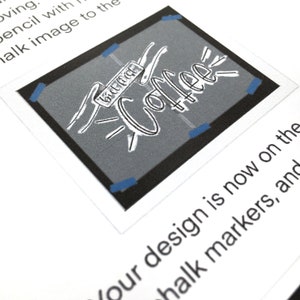 May include: A black and white illustration of the word "Coffee" with a banner that says "but first, coffee" above it. The illustration is on a gray background.