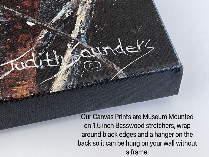 May include: Close-up of a black canvas print with a white signature that reads "Judith Saunders". The print is mounted on 1.5 inch basswood stretchers with black edges and a hanger on the back.