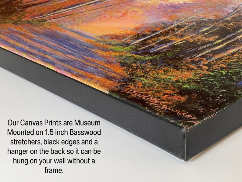 May include: A close-up of the edge of a canvas print, showing the 1.5 inch basswood stretcher bars, black edges, and a hanger on the back. The text "Our Canvas Prints are Museum Mounted on 1.5 inch Basswood stretchers, black edges and a hanger on the back so it can be hung on your wall without a frame." is visible below the print.