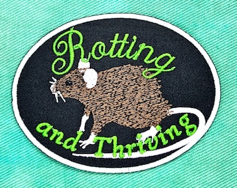 Fer à rat pourrissant et prospère sur l'écusson