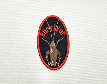 Overlevende kakkerlakinsect borduurwerk opstrijkpatch