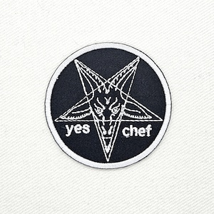 May include: Embroidered patch featuring a white pentagram with a goat's head inside a black circle. The words "yes" and "chef" are written on either side of the pentagram in white. The patch has a white border.