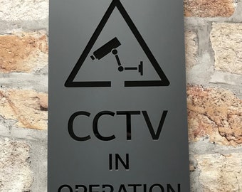 Cartello moderno "telecamere a circuito chiuso in funzione"