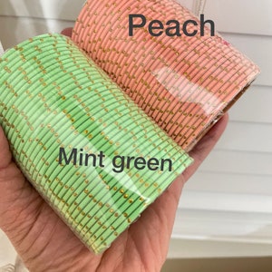 May include: Two bundles of bangles in mint green and peach. The bangles are decorated with small gold-colored accents. The text "Mint green" and "Peach" are superimposed on the image.