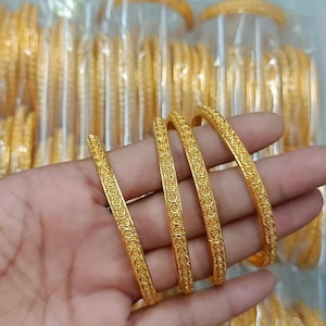 Set of 4 gold bangles/ gold stones bangles/real gold Look alike