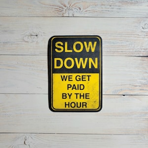 Slow Down We Get Paid By the Hour Vinyl Waterproof Sticker, construction humor, blue collar, hard hats, tradesman, made by Artsy not Craftsy