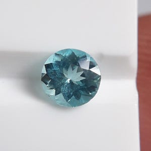 Neon Blue Paraiba Tourmaline: 0.30 ct Round Cut Gemstone