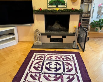 Patchwork quilt blanket: large purple graphic quilt made of harmonious Bali batik fabrics, very elaborately embroidered