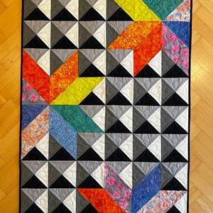 Patchwork quilt blanket: Stylized Bali batik stars on a plastic background