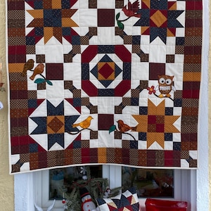 Patchwork quilt blanket in a traditional pattern: animals in the forest. Free bonus pillow.