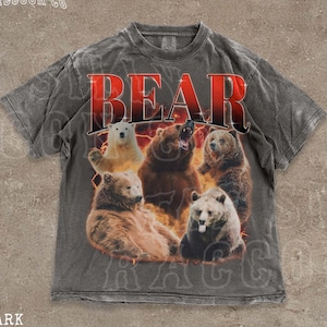 A t-shirt with a graphic design featuring a group of bears in various poses, including one with its mouth open and another with its head raised.