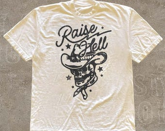 Camiseta de calavera vaquera "Raise Hell" - Camiseta con gráfico retro del oeste - Camiseta gótica del oeste - Camiseta con estética country