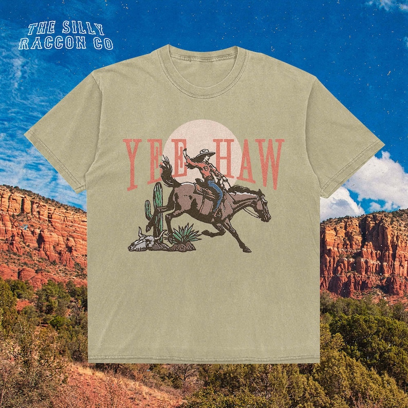 a t - shirt with a cowboy riding a horse