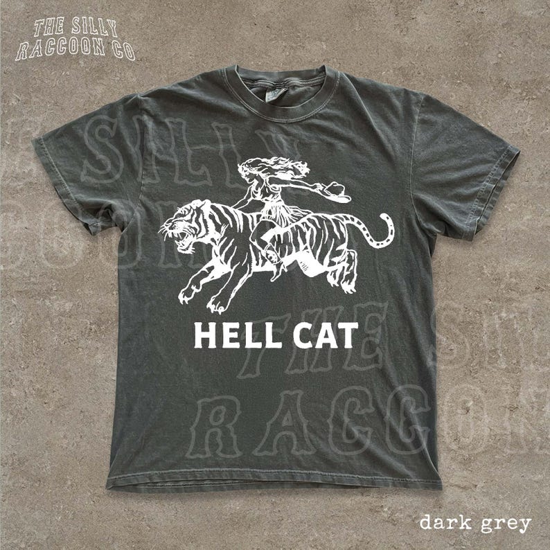 A grey t-shirt with a graphic design depicting a person riding a tiger.
