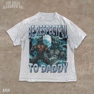 A white t-shirt with a graphic design featuring two werewolves and the text "BE RESPECTFUL TO DADDY" printed on it.