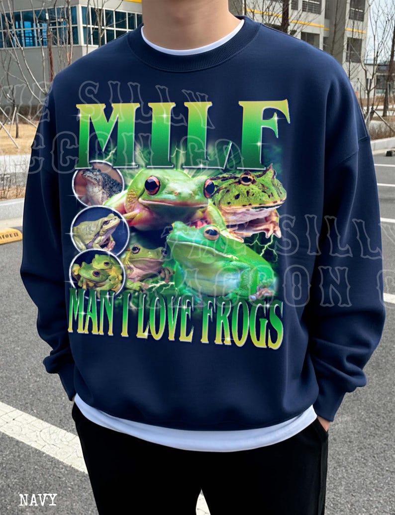 A navy blue sweatshirt with a graphic design featuring multiple green frogs.