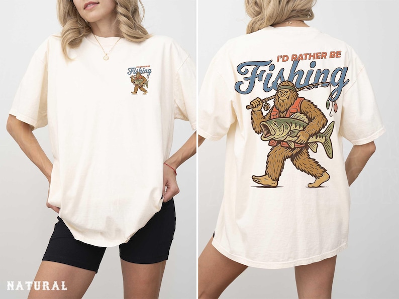 A woman wearing a white t-shirt with a graphic design of a fishing giant on the back.