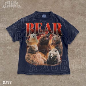 A navy blue t-shirt with a graphic design featuring a group of bears in various poses, including one with its mouth open and another with its head tilted back.