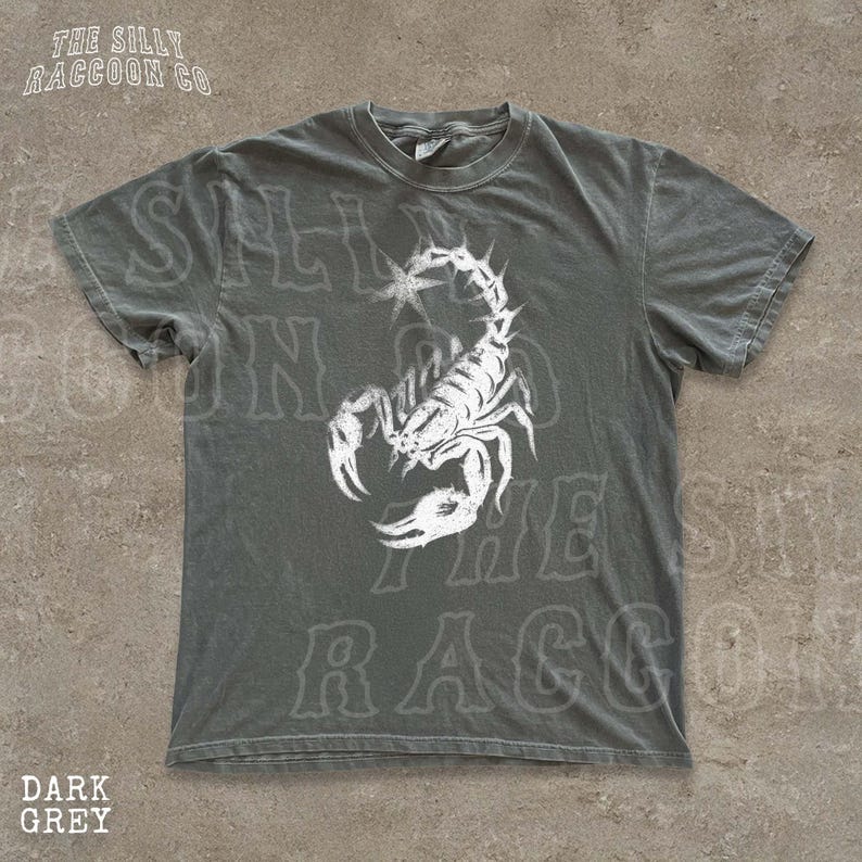 A gray t-shirt with a white graphic of a scorpion printed on it.
