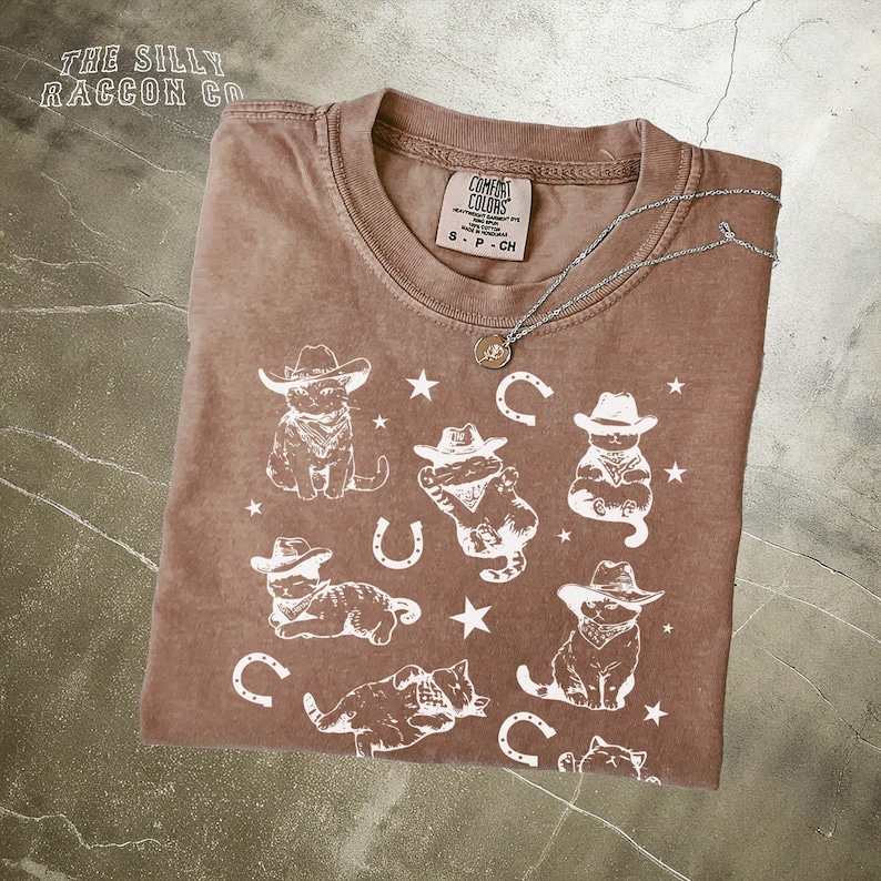a t - shirt with a picture of cowboys on it