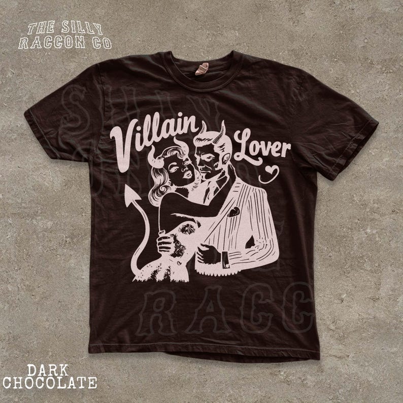 A black t-shirt with a graphic design featuring a man and a woman embracing, with the text " Villain Lover" and "RAC" printed on it.